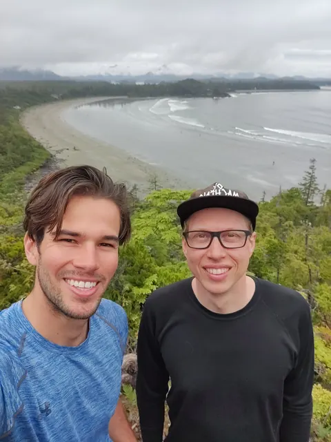 Eric and a friend on the coast near Tofino