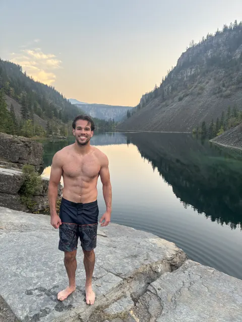 Eric taking a swim at a quiet mountain lake